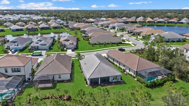 aerial view with a water view and a residential view