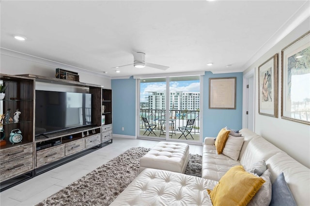 living area with marble finish floor, ceiling fan, baseboards, and ornamental molding