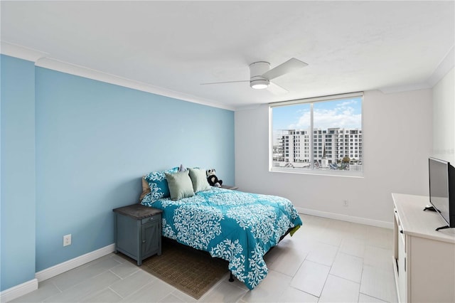 bedroom featuring ornamental molding, ceiling fan, and baseboards