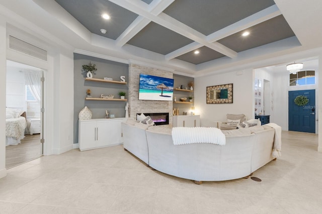 living area with a large fireplace, light tile patterned floors, coffered ceiling, and beam ceiling