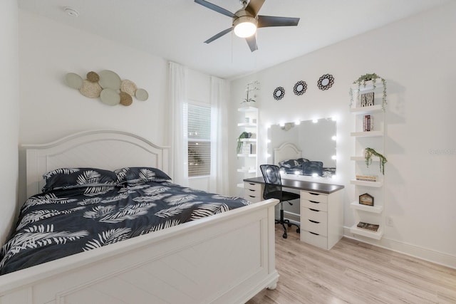 bedroom featuring light wood-style floors, ceiling fan, and baseboards