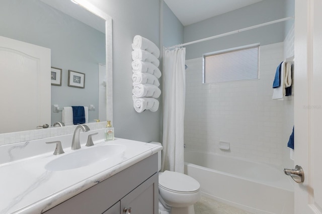 full bathroom featuring vanity, shower / bath combination with curtain, and toilet