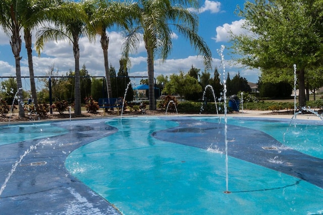 community pool featuring fence