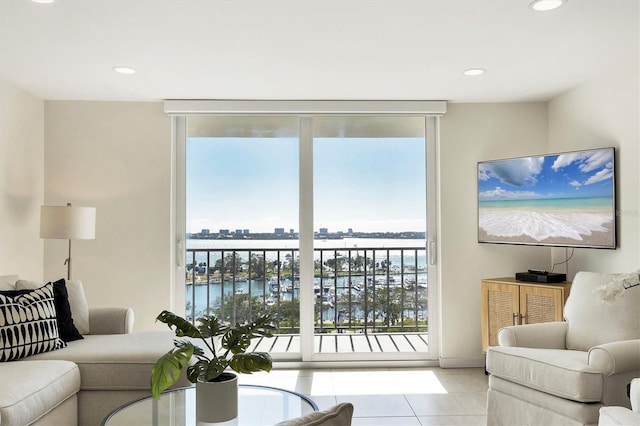 living room featuring a wall of windows, recessed lighting, and tile patterned floors