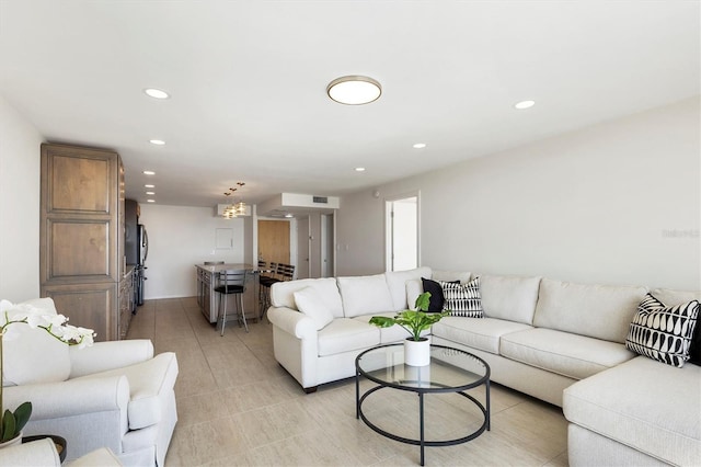 living area with recessed lighting, visible vents, and light tile patterned floors