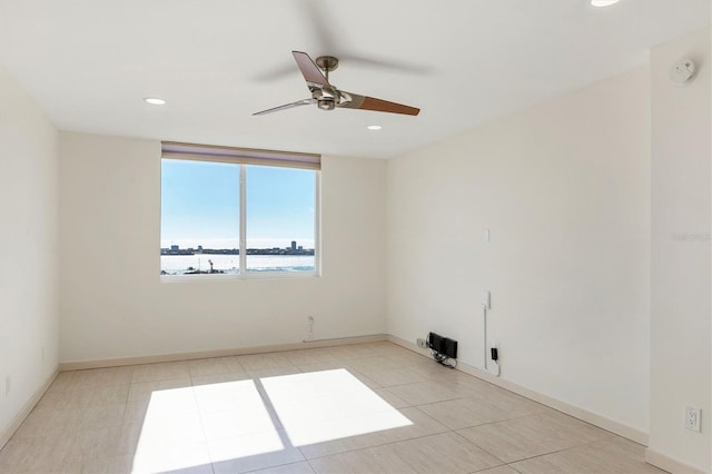 spare room featuring ceiling fan, baseboards, tile patterned flooring, and recessed lighting