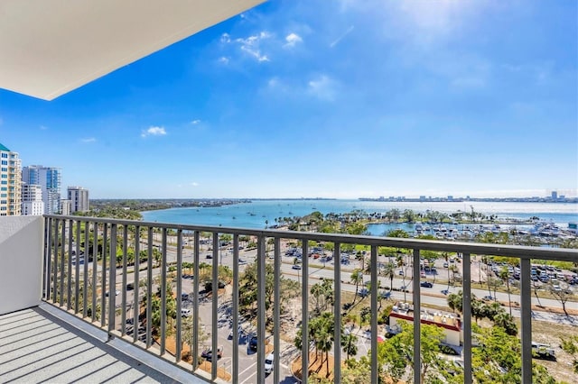 balcony with a water view and a city view