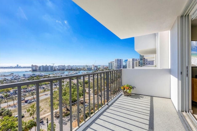 balcony with a view of city and a water view