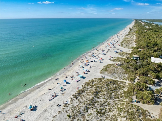 aerial view featuring a water view and a beach view