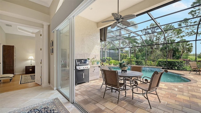 view of patio featuring visible vents, a grill, ceiling fan, a lanai, and an outdoor pool