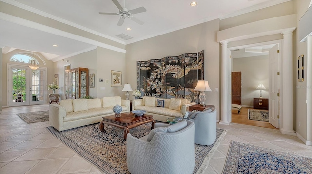 living area featuring light tile patterned floors, ornate columns, baseboards, and crown molding