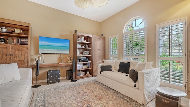 living room featuring tile patterned flooring and baseboards