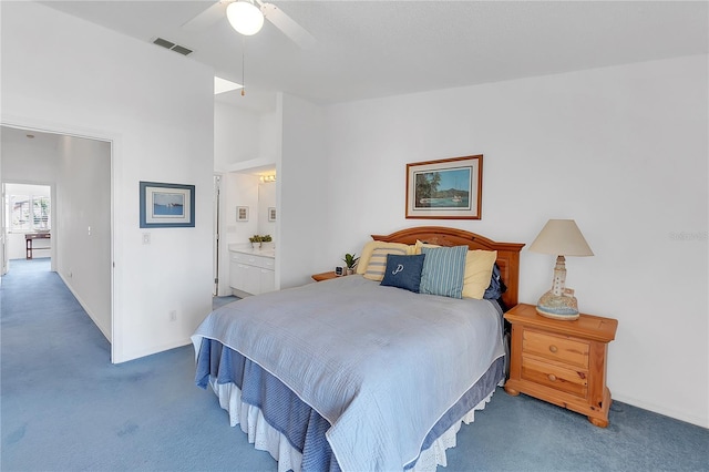 carpeted bedroom with a ceiling fan, visible vents, and vaulted ceiling