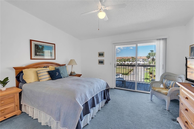 carpeted bedroom featuring lofted ceiling, ceiling fan, a textured ceiling, and access to exterior