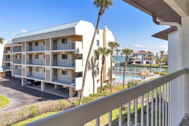 balcony featuring a water view