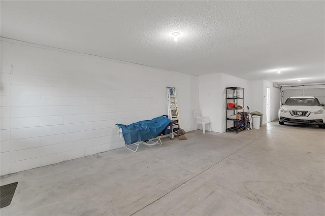 garage featuring concrete block wall