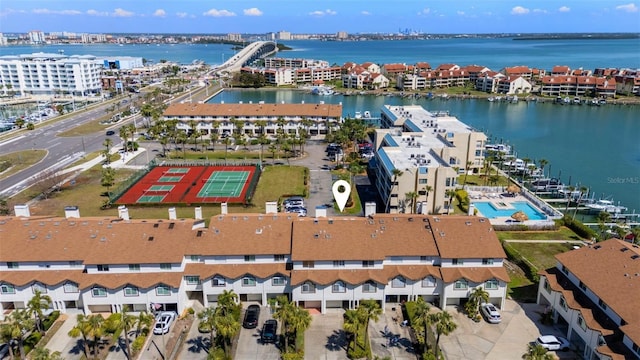 birds eye view of property with a water view