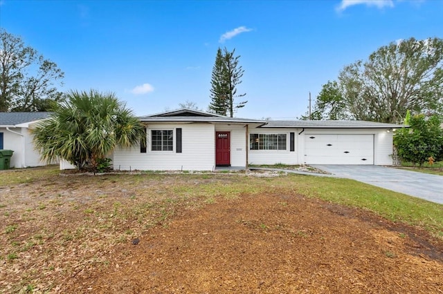 ranch-style house with a garage and driveway