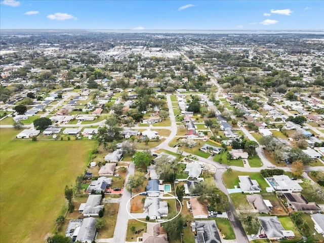 birds eye view of property with a residential view