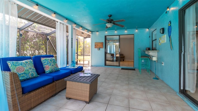 view of patio / terrace featuring a ceiling fan, a lanai, and an outdoor hangout area