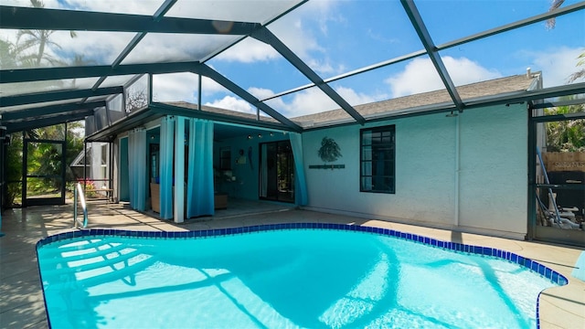 outdoor pool featuring a patio and a lanai