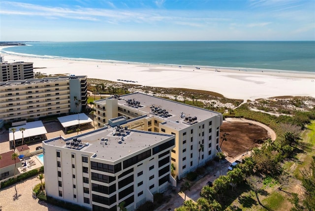 bird's eye view with a water view and a view of the beach