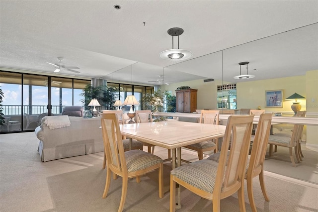 5740 Midnight Pass Rd Unit 402, Sarasota, FL 34242 - dining room featuring light carpet, ceiling fan, a textured ceiling, and visible vents