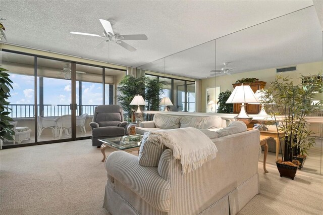 5740 Midnight Pass Rd Unit 402, Sarasota, FL 34242 - carpeted living area with ceiling fan, visible vents, and a textured ceiling