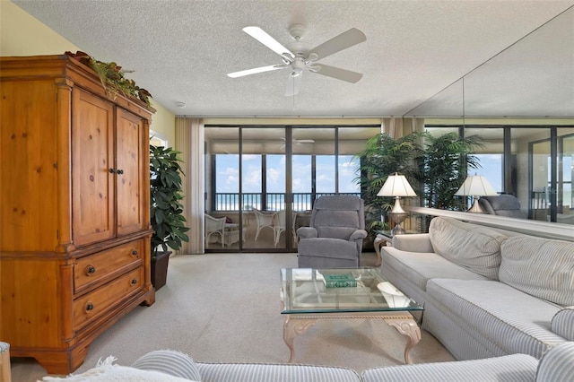 5740 Midnight Pass Rd Unit 402, Sarasota, FL 34242 - living room with a ceiling fan, carpet, and a textured ceiling