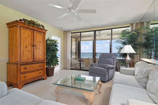5740 Midnight Pass Rd Unit 402, Sarasota, FL 34242 - living area featuring carpet, ceiling fan, and a textured ceiling