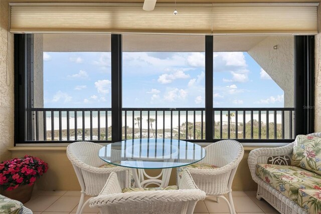 5740 Midnight Pass Rd Unit 402, Sarasota, FL 34242 - sunroom / solarium featuring plenty of natural light and a water view