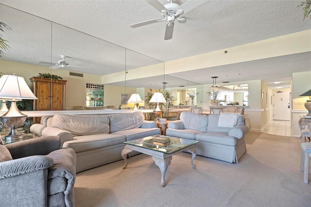 5740 Midnight Pass Rd Unit 402, Sarasota, FL 34242 - living area featuring a textured ceiling, ceiling fan, light carpet, and visible vents