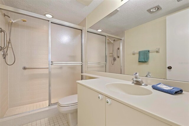 5740 Midnight Pass Rd Unit 402, Sarasota, FL 34242 - full bathroom featuring a textured ceiling, a shower stall, and toilet
