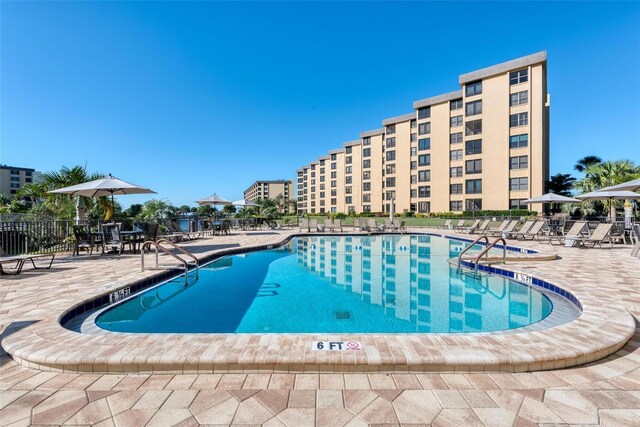 5740 Midnight Pass Rd Unit 402, Sarasota, FL 34242 - view of swimming pool with a patio area and fence