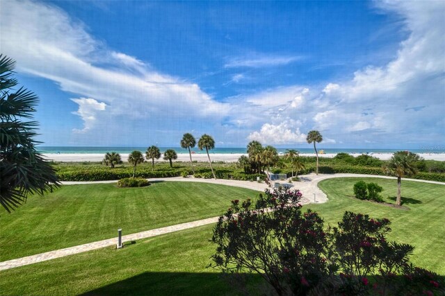 5740 Midnight Pass Rd Unit 402, Sarasota, FL 34242 - view of home's community with a water view, a lawn, and a beach view