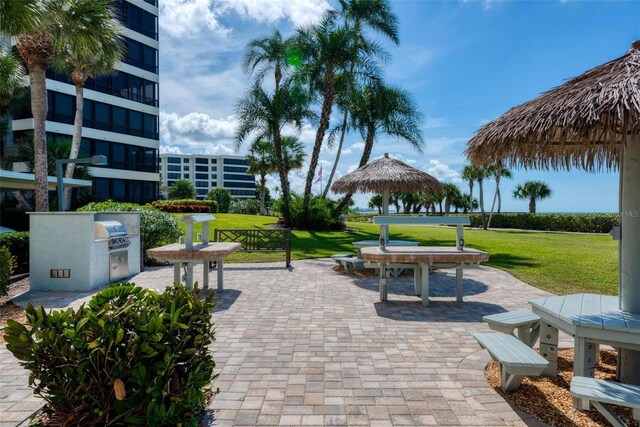 5740 Midnight Pass Rd Unit 402, Sarasota, FL 34242 - view of property's community with a gazebo, a lawn, and a patio