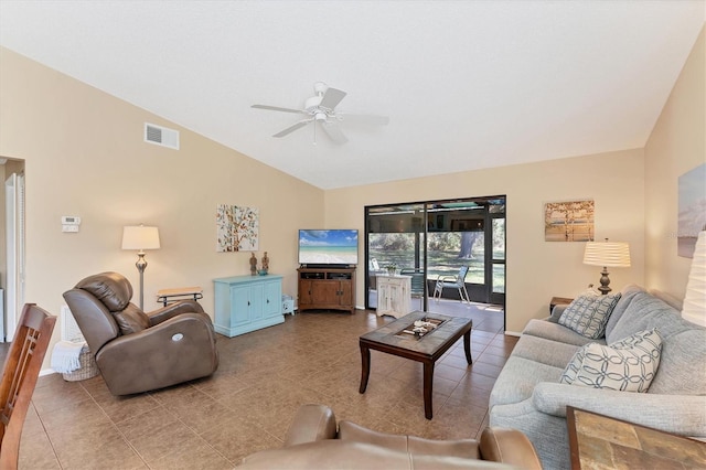 living room with lofted ceiling, visible vents, ceiling fan, tile patterned flooring, and baseboards