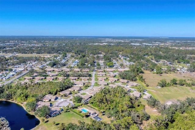 bird's eye view featuring a residential view and a water view