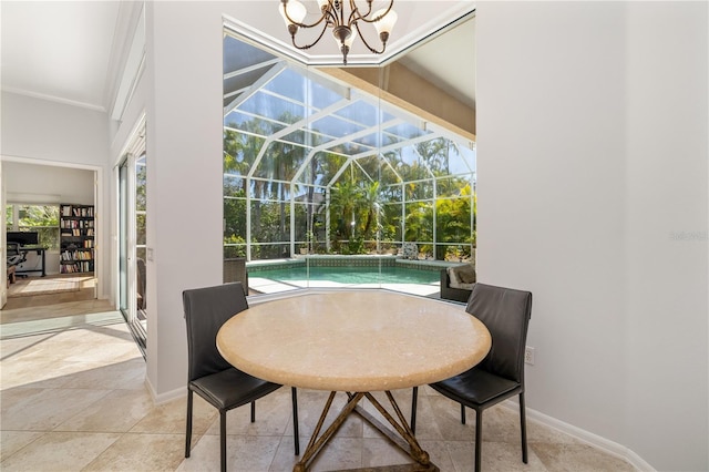 dining space featuring a sunroom, baseboards, and ornamental molding