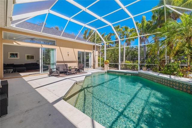 outdoor pool featuring a patio, outdoor lounge area, and a lanai