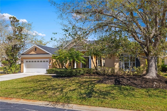 view of front of property with driveway, a garage, a front lawn, and stucco siding