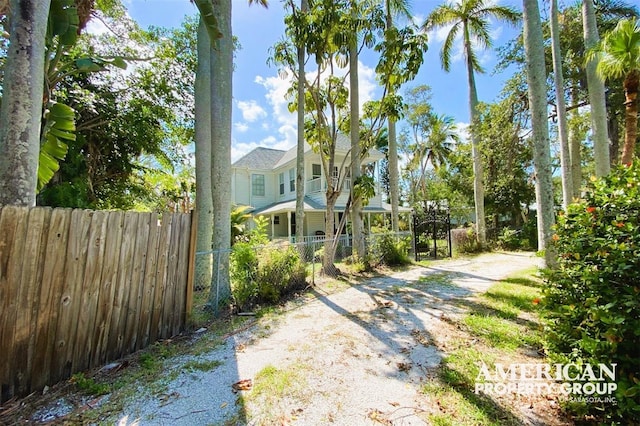 exterior space featuring a fenced front yard and driveway