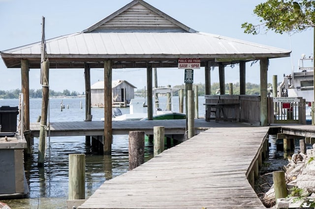 dock area featuring a water view and boat lift