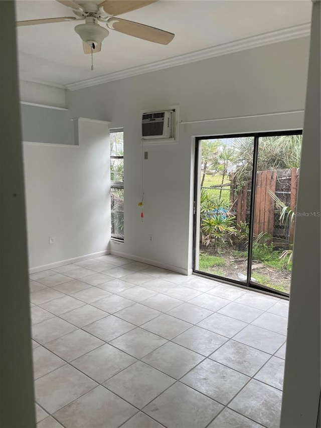 unfurnished room featuring light tile patterned floors, ornamental molding, a wall unit AC, and baseboards