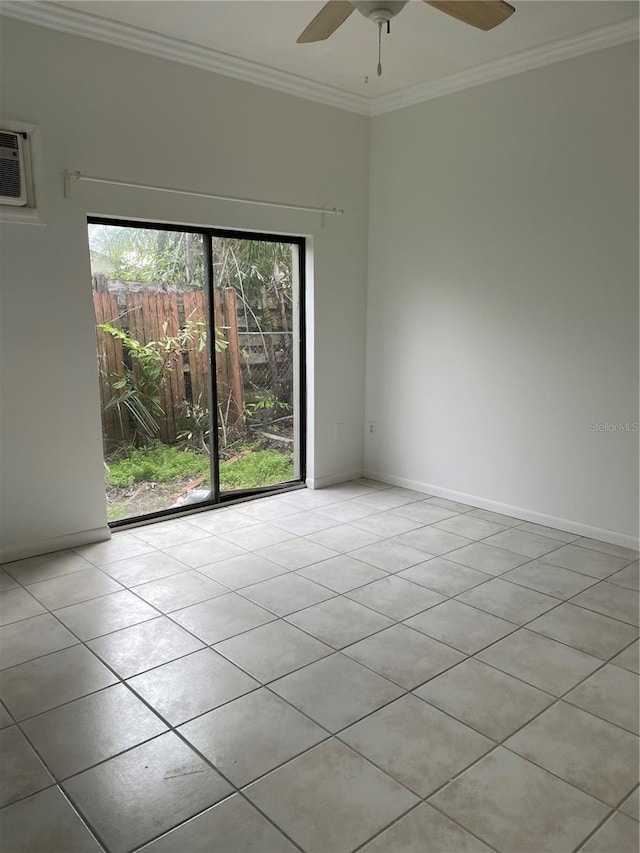 spare room with an AC wall unit, ornamental molding, a ceiling fan, and baseboards