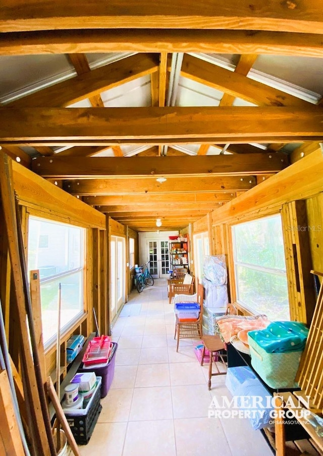 sunroom featuring lofted ceiling