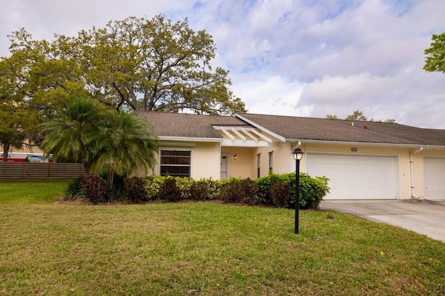 view of front of house featuring a front yard, fence, and stucco siding