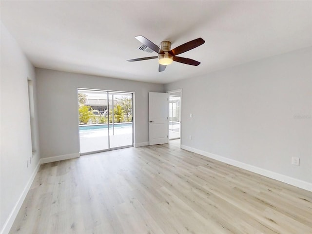 unfurnished room with light wood-style flooring, baseboards, and a ceiling fan