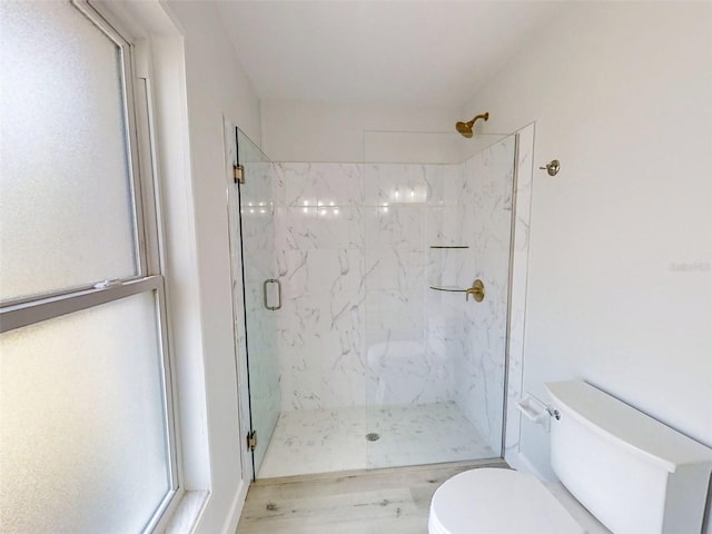 full bathroom featuring a marble finish shower and toilet