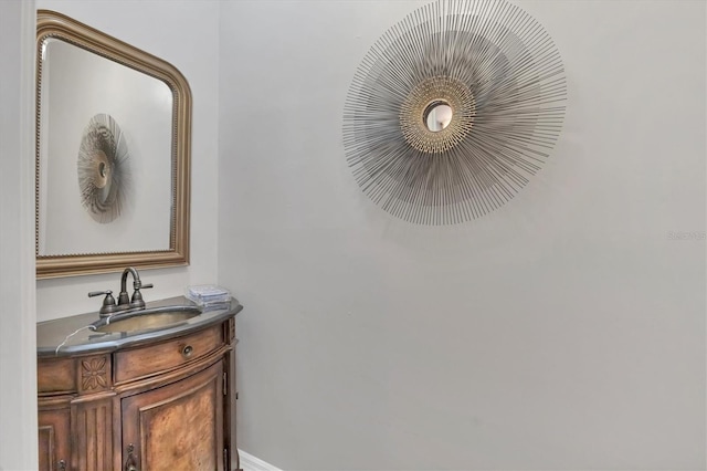 bathroom with vanity and baseboards